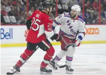  ?? TONY CALDWELL ?? Ottawa Senators right wing Chris Neil and New York Rangers left wing Tanner Glass helped make Game 5 of their series a more physical affair than in games 1 and 2, when neither were in the lineup.