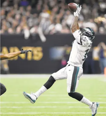  ?? BILL FEIG/AP ?? Philadelph­ia Eagles wide receiver Alshon Jeffery pulls in a reception against New Orleans Saints in the first half of Sunday's game at the Superdome in New Orleans.