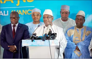  ??  ?? Keita addresses supporters at his party headquarte­rs in Bamako. — AFP photo