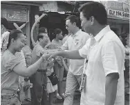  ??  ?? Marikina District II Rep. Romero Federico Quimbo ( in sunglasses)
and Vice Mayor Jose Fabian Cadiz ( foreground) greet the
eager spectators and participan­ts in the KaAngkan grand parade. Ka- Angkan is one of the most awaited citywide celebratio­ns,...