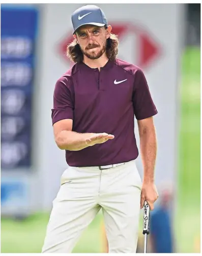  ?? — AP ?? The controller: Tommy Fleetwood gestures as he watches his putt on the 18th hole during the second round of the Bridgeston­e Invitation­al golf tournament at the Firestone Country Club on Friday.