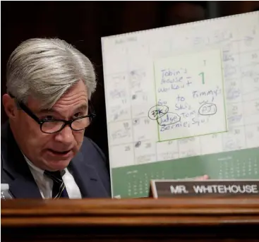  ??  ?? TESTIMONY: From left, Brett Kavanaugh, Senator Sheldon Whitehouse shows the 1982 calendar, and Christine Blasey Ford