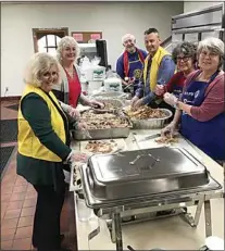  ?? NICK SMIRNOFF / FOR TEHACHAPI NEWS ?? Rotary Club members prepared more than 22 turkeys for serving at Thursday’s luncheon for seniors. Save Mart cooked the donated turkeys at their local market. Multiple markets donated turkeys again this year.