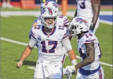  ?? Timothy T Ludwig / Getty Images ?? Bills QB Josh Allen, left, is “looking like an MVP candidate for years to come,” says Hall of Famer Thurman Thomas.