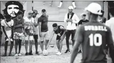  ??  ?? Soccer is an increasing­ly popular street sport in Cuban capital Havana.