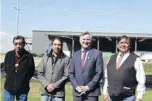  ?? STEPHANIE BABYCH/FILES ?? From left, elder Gerald Meguinis, councilman Ellery Starlight, Indigenous Relations Minister Minister Richard Feehan and Chief Lee Crowchild in front of the under-constructi­on sportsplex.