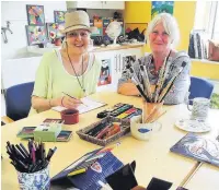  ??  ?? ●● From left, patient Sarah Shackleton-Lamptey and art therapist Fay Mitchell at the Sunflower Centre, run by East Cheshire Hospice