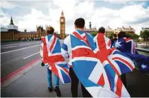  ?? Odd Andersen / AFP/Getty Images ?? Union flags helped some Britons make a statement on Westminste­r Bridge on Sunday, when Britain’s opposition Labour party plunged into turmoil.