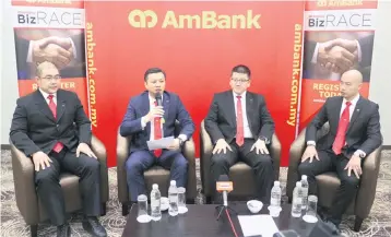  ??  ?? The AmBank business banking management team is seen speaking to local media during a conference yesterday. From left is AmBank senior vice president of commercial sales in Sarawak Tony Tong, Yap, senior vice president of portfolio developmen­t Tay Ming...