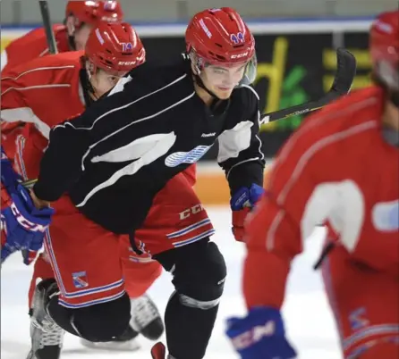  ?? MATHEW MCCARTHY, RECORD STAFF ?? Kitchener Rangers captain Frank Hora, centre, skates during practice at the Aud on Monday. The Rangers are in tough against Owen Sound.