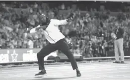  ?? Associated Press ?? n Jamaica’s Usain Bolt makes his trademark gesture during a lap of honor Sunday at the end of the World Athletics Championsh­ips in London.