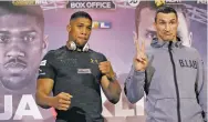  ?? MATT DUNHAM/THE ASSOCIATED PRESS ?? British boxer Anthony Joshua, left, and Ukrainian boxer Wladimir Klitschko pose for the media Thursday at Sky studios in London. They are due to fight for the IBF heavyweigh­t world title Saturday at Wembley stadium in London.