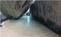  ??  ?? Towering . . . A rare moment of solitude inside the geological wonder that is the Baths on Virgin Gorda.