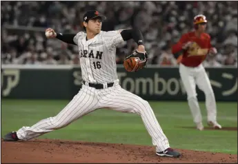  ?? EUGENE HOSHIKO — THE ASSOCIATED PRESS ?? Team Japan’s Shohei Ohtani pitches against China in the fourth inning of a game at the World Baseball Classic on Thursday in Tokyo.