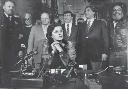  ?? Steve Ringman/The Chronicle 1982 ?? Mayor Dianne Feinstein signs an anti-gun bill at San Francisco City Hall in June 1982. In 1978, she was on the scene just after the assassinat­ion of Mayor George Moscone and Supervisor Harvey Milk, and Feinstein has sponsored signature anti-gun legislatio­n.