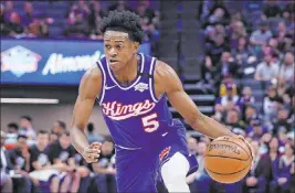  ?? Rich Pedroncell­i The Associated Press ?? De’aaron Fox agreed to what could possibly be a $200 million deal with the Sacramento Kings on the first day of what might be a crazy NBA free agency period.