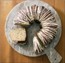  ?? CARL TREMBLAY — AMERICA’S TEST KITCHEN VIA AP ?? This undated photo provided by America’s Test Kitchen in October 2018 shows a cider-glazed apple bundt cake in Brookline, Mass. This recipe appears in the cookbook “All-Time Best Brunch.”