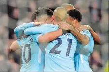  ?? RUI VIEIRA/AP PHOTO ?? Manchester City’s Sergio Aguero, left, celebrates with teammates after scoring his second goal, his side’s third, during the English Premier League match between Manchester City and Bournemout­h on Saturday at Etihad Stadium in Manchester, England.