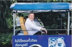  ?? DANIEL BRUNSKILL/INTEREST ?? Prime Minister Christophe­r Luxon raises the energy around New Zealand’s foreign relations, this time with a spin in an electric tuk tuk in Thailand.