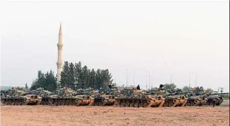  ??  ?? On guard: turkish tanks stationed near the syrian border, in Karkamis, turkey. — AP