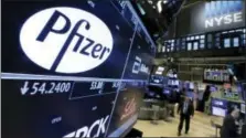  ?? RICHARD DREW — THE ASSOCIATED PRESS FILE ?? The Pfizer logo appears on a screen above its trading post on the floor of the New York Stock Exchange.