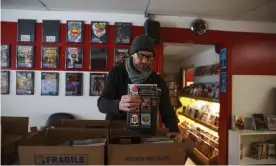  ?? Photograph: Barcroft Media/ Getty Images ?? Matt Traughber, an owner of the Vintage Phoenix comic bookstop in Indiana, packing comics to distribute to subscriber­s a day early, on 24 March.