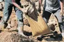  ?? Photo / AP ?? Many rescuers in Itogon have been digging and removing debris by hand.