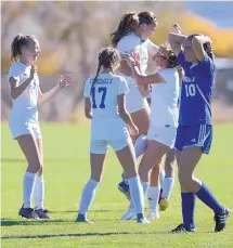  ?? ADOLPHE PIERRE-LOUIS/JOURNAL ?? Bosque School’s Aviva Elliott, right, reacts as St. Michael’s players celebrate following a goal. No. 6-seeded St. Michael’s earned a 3-2 win over the Bobcats to advance to today’s semifinals.