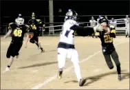  ?? MARK HUMPHREY ENTERPRISE-LEADER ?? Prairie Grove sophomore cornerback Cody Kruse (5-5, 108 pounds), who may have been the smallest player on the field, jumps a pass intended for Pottsville’s Bradlee Denney. The Tigers recorded a 56-21 first-round playoff victory over Pottsville last week.