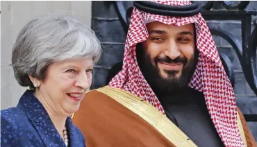  ??  ?? Red carpet treatment: Theresa May hosts Mohammad bin Salman at No 10 in March