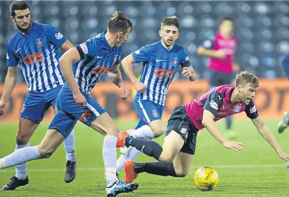  ??  ?? Dundee’s Rory Loy goes flying after a challenge from Kilmarnock’s Gary Dicker during the Dark Blues’ 2-0 defeat on Saturday.