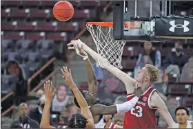  ?? Associated Press ?? Defense: Arkansas forward Connor Vanover (23) defends a shot by South Carolina forward Keyshawn Bryant during the first half of an NCAA college basketball game Tuesday in Columbia, S.C. The Razorbacks host Texas A&M today.