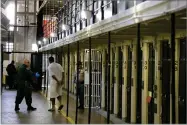  ?? AP FILE PHOTO BY ERIC RISBERG ?? In this 2016 photo, a condemned inmate is led out of his east block cell on death row at San Quentin State Prison in San Quentin, Calif.