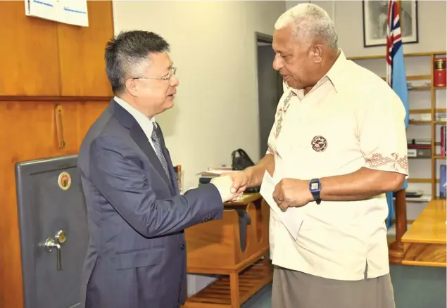  ?? Photo: Office of the Prime Minister ?? In 2018, Prime Minister Voreqe Bainimaram­a had received a cheque of $100,000 from the People’s Republic of China Ambassador Qian Bo to assist those Fijians affected during Tropical Cyclone Gita.
