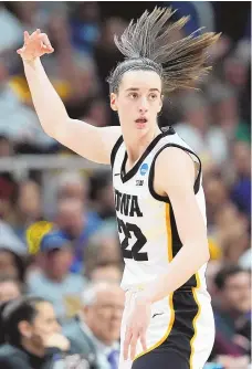  ?? ASSOCIATED PRESS ?? Iowa guard Caitlin Clark reacts after hitting a 3-pointer against Colorado during Saturday’s NCAA Tournament Sweet 16 game in Albany, N.Y.