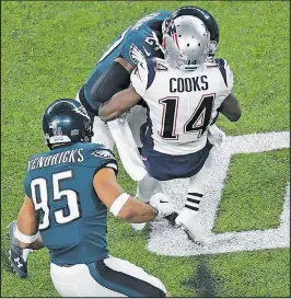  ?? GeTTy ImaGeS ?? Patriots’ Brandin Cooks takes a vicious hit from Melvin Jenkins after making a catch and spinning to turn upfield. He wouldn’t return.