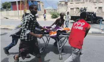  ?? Reuters ?? Nine people were killed and 10 injured after a suicide car bombing and an attack by gunmen at Somalia’s interior ministry, near the presidenti­al palace, in Mogadishu yesterday