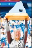  ??  ?? Dutch player Kiki Bertens holds her trophy after winning the final of the Gstaad WTA tennis tournament on
July 23, in Gstaad. (AFP)