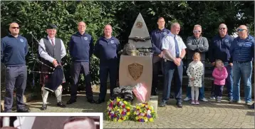  ??  ?? Members of Wicklow Fire Service, family and friends gathered at the monument at Father Collohan Terrace to remember Mark O’Shaughness­y and Brian Murray (left).