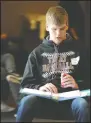  ??  ?? Above: Tokay High team member Jack Gobel, 16, studies before the championsh­ip round of the Central Valley Regional Science Bowl at Tokay High School in Lodi on Saturday. Left: Tokay High team members Jasmin Gill, 15, Rubie Dhillon, 15, Gobel, and Matt...