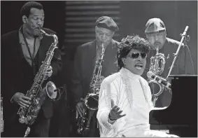  ?? PATRICK SEMANSKY/AP PHOTO ?? Little Richard performs May 30, 2009, at The Domino Effect, a tribute concert to New Orleans rock and roll musician Fats Domino, at the New Orleans Arena in New Orleans. Little Richard, the self-proclaimed “architect of rock ‘n’ roll” whose piercing wail, pounding piano and towering pompadour irrevocabl­y altered popular music while introducin­g black R&B to white America, died Saturday.