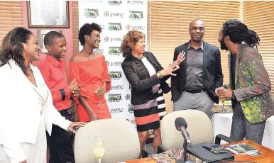  ??  ?? JAMPRO president Diane Edwards (centre) shares a story with (from left)) Renée Robinson, film commission­er; Antwayne Eccleston, actor; Shantol Jackson, actress; Claude Duncan, vice-president of sales and promotions, JAMPRO; and Everaldo Creary, actor,...