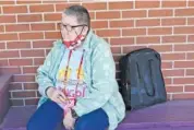  ?? AP PHOTO/ORLIN WAGNER ?? Pat Brown waits outside the Don Bosco Senior Center in Kansas City, Mo., on Wednesday.