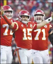  ?? Associated Press ?? CELEBRATIO­N — Kansas City Chiefs quarterbac­k Patrick Mahomes (15) celebrates a touchdown pass with Eric Fisher (72) and Mitchell Schwartz (71) during the second half of the NFL AFC Championsh­ip game against the Tennessee Titans on Sunday in Kansas City, Missouri.