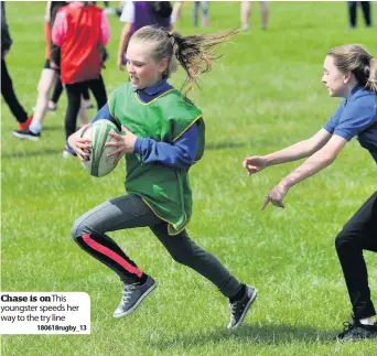  ??  ?? Chase is onThis youngster speeds her way to the try line