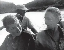  ??  ?? “Georgia O’Keeffe, Marshall Girard and Guide Kenny Ross,” 1961, gelatin silver print by Todd Webb.