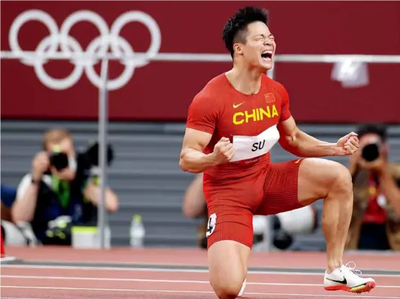  ?? ?? August 1, 2021: Su Bingtian becomes the first Chinese sprinter to qualify for the Olympic men’s 100m final at the 2021 Tokyo Olympics. Su clocked a personal best and a new Asian record of 9.83 seconds in the semifinals to secure a place in the final. by Wang Lili/xinhua