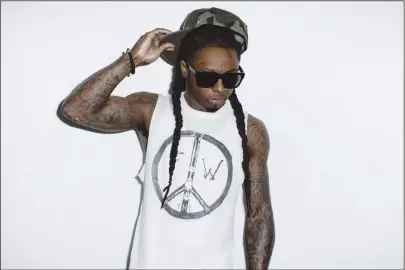  ?? Nabil/Universal Music Group ?? Lil’ Wayne in 2011. Once at the top of the rap game, he fell just as rapidly as he rose.
