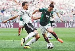  ?? AP ?? Germany’s Mats Hummels (left) and Mexico’s Javier Hernandez vie for the ball during the Group F match yesterday.
