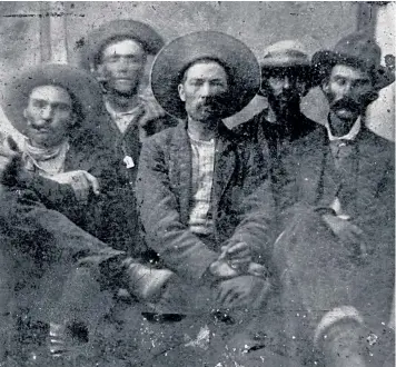  ??  ?? The picture owned by Frank Abrams (above) shows what historians believe is Billy the Kid, second left, and Pat Garrett, far right. The pair had previously only been seen in separate photos (left)